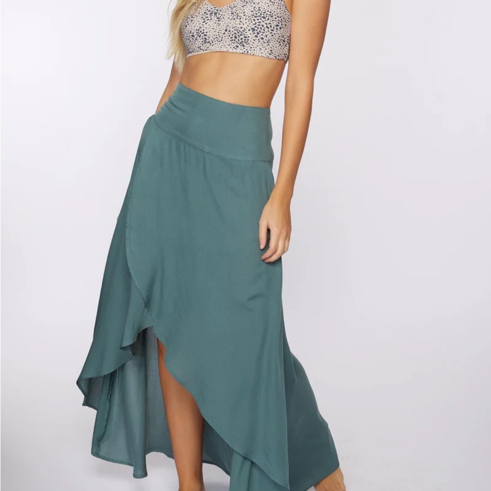 Style with a crop top and sandals for summer and boots and a sweater for fall.
